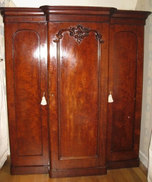 mahogany three door breakfront wardrobe