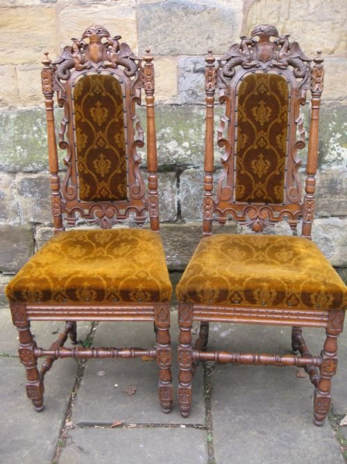 pair of carved oak hall chairs
