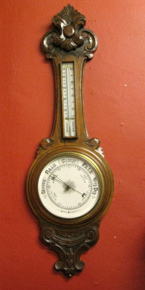 large carved oak aneroid barometer