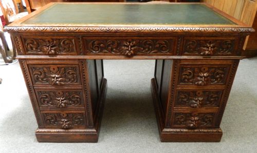 carved oak green man desk