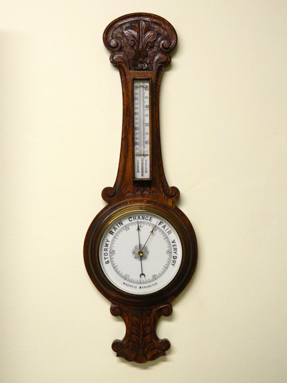 carved oak barometer