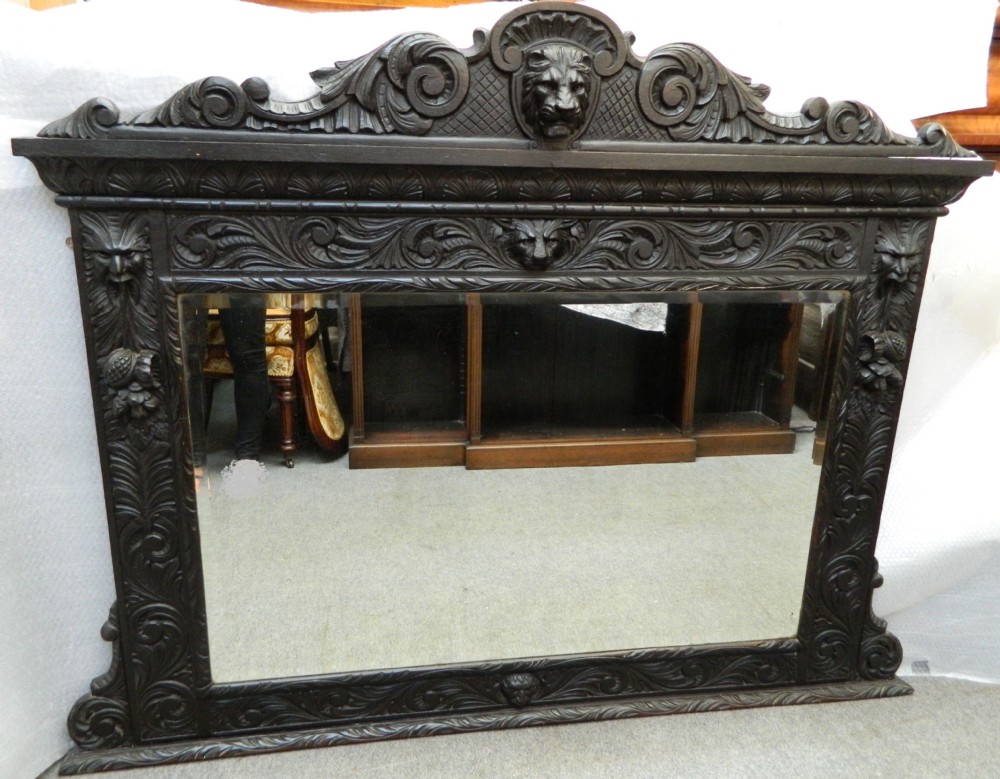 large carved oak green man mirror