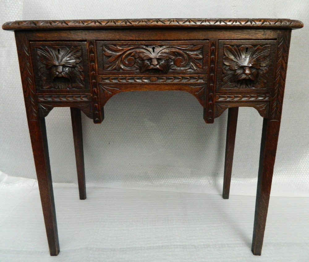 carved oak green man table