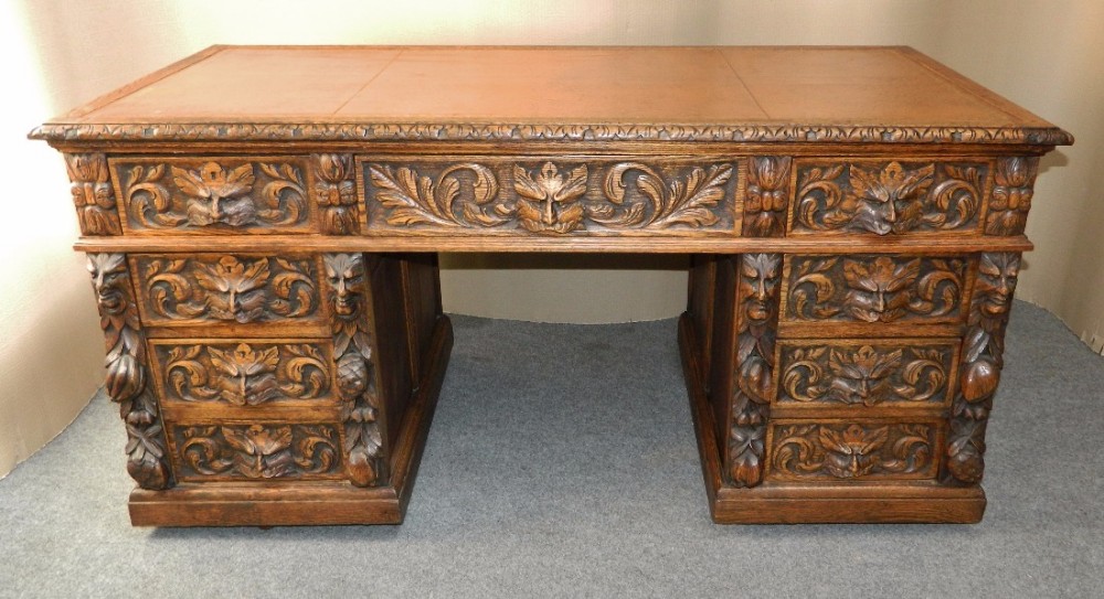 carved oak green man desk