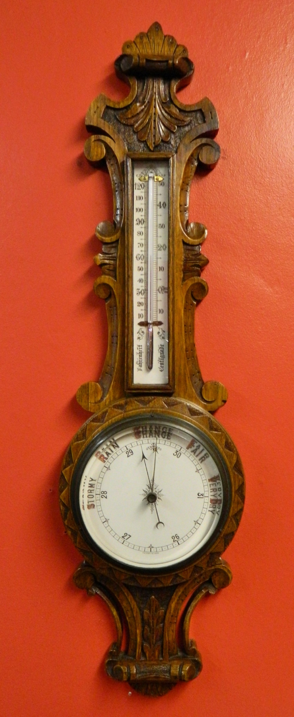 carved oak barometer