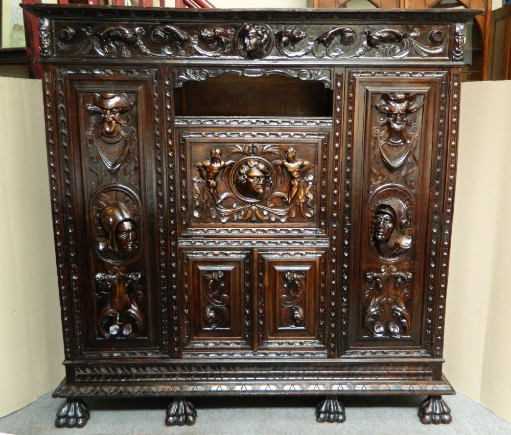 large carved oak cupboard