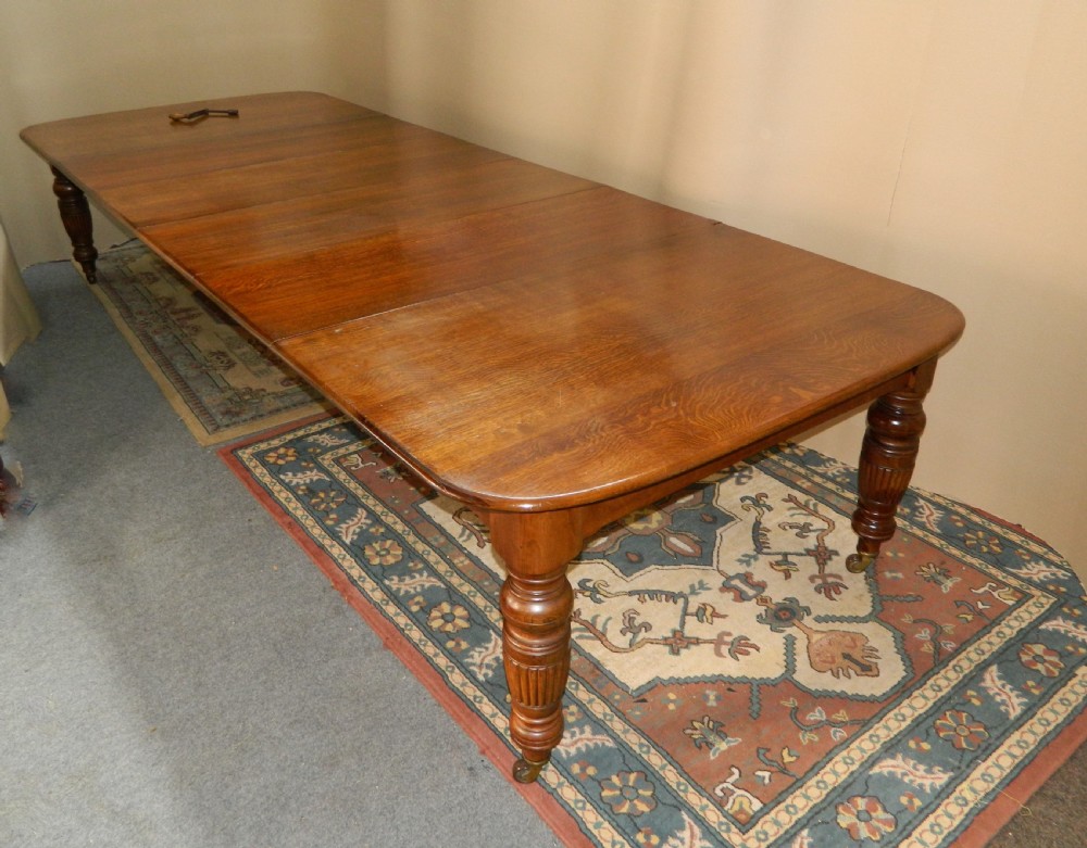 extending oak dining table with 4 leaves