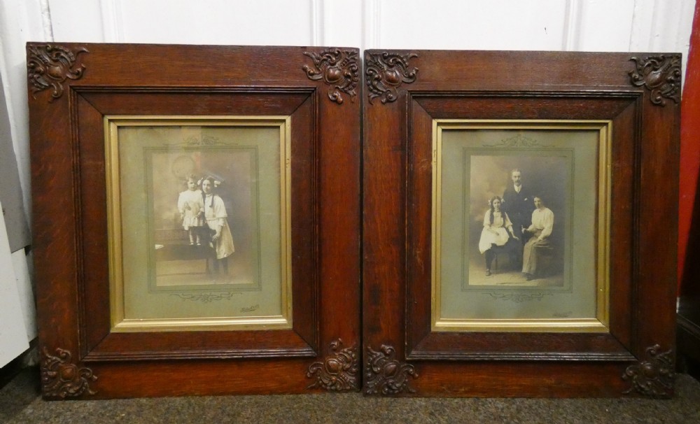 pair of large framed photographs