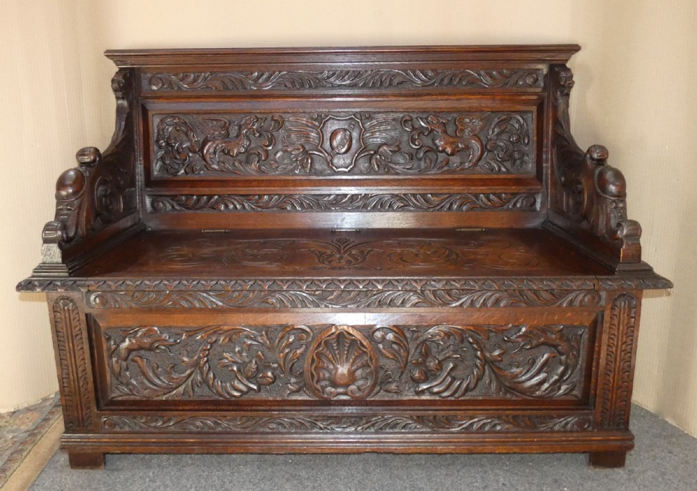 carved oak settle