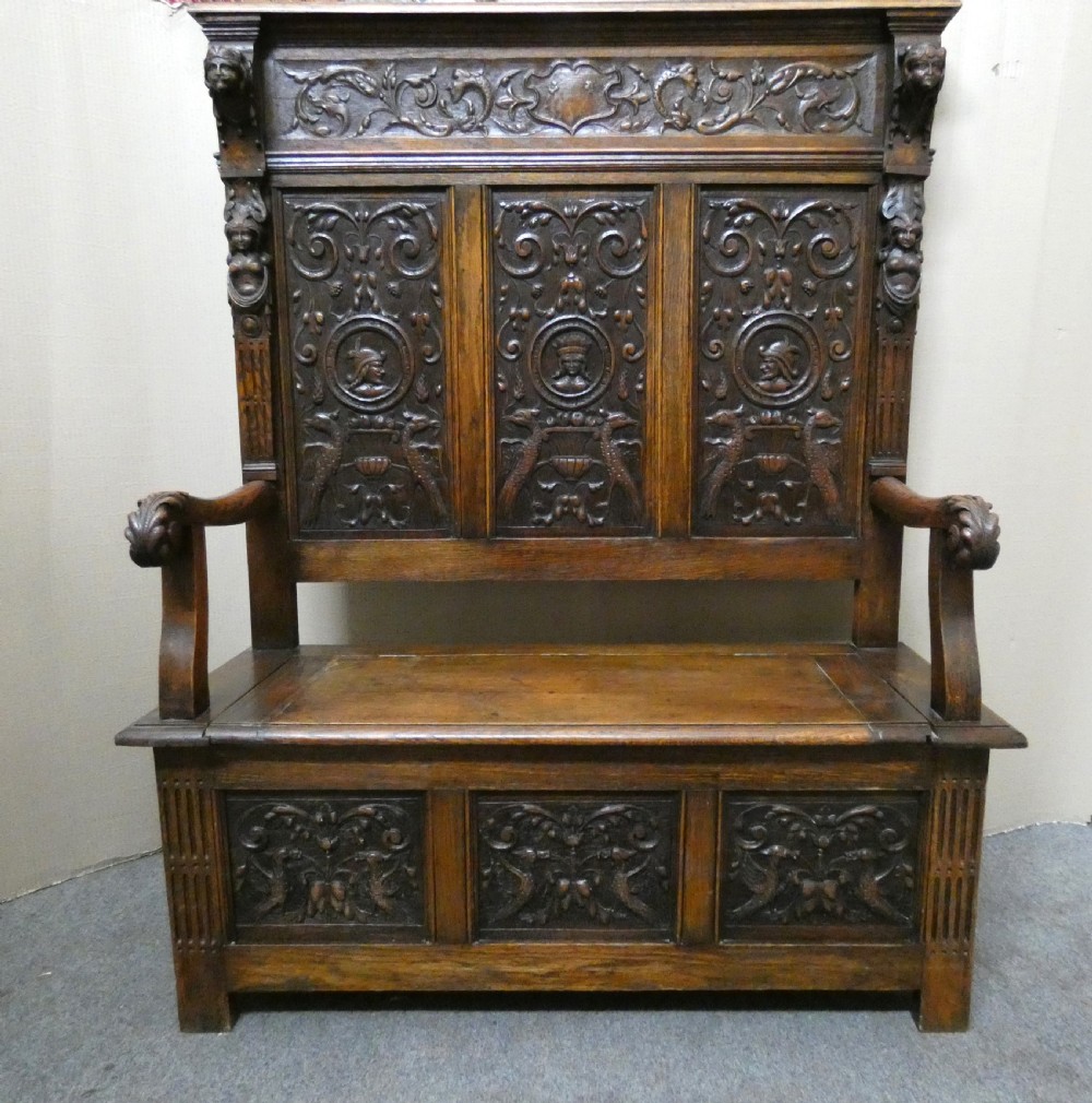 carved oak high back settle